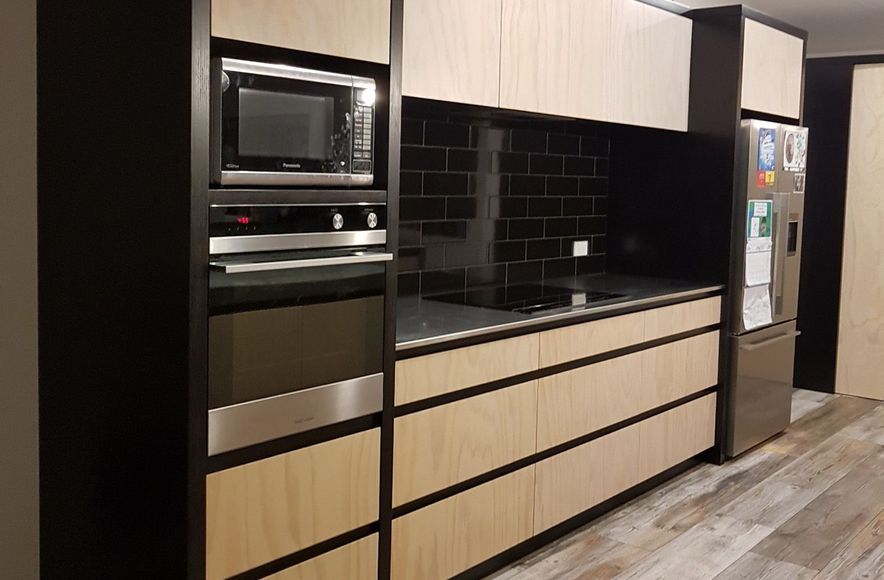 Black & Whitewashed plywood kitchen