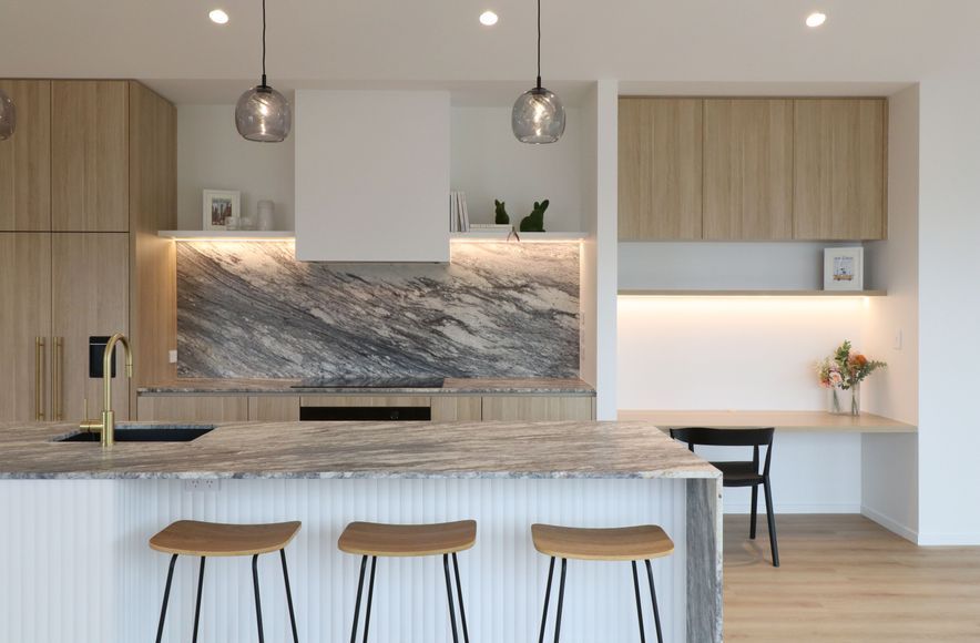 Curved Timber Island with Leathered Granite Elegance