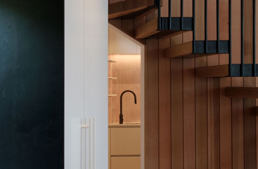 White V groove, black island and a scullery with a touch of pink