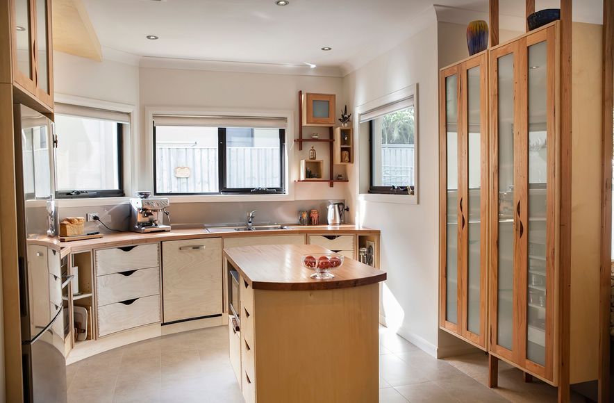 Plywood and Recycled Timber Curved Kitchen