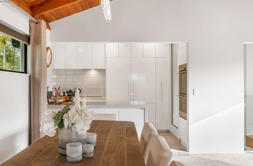 “From Stairs to Storage: How Recessing a Wall Oven can Transform the Kitchen”