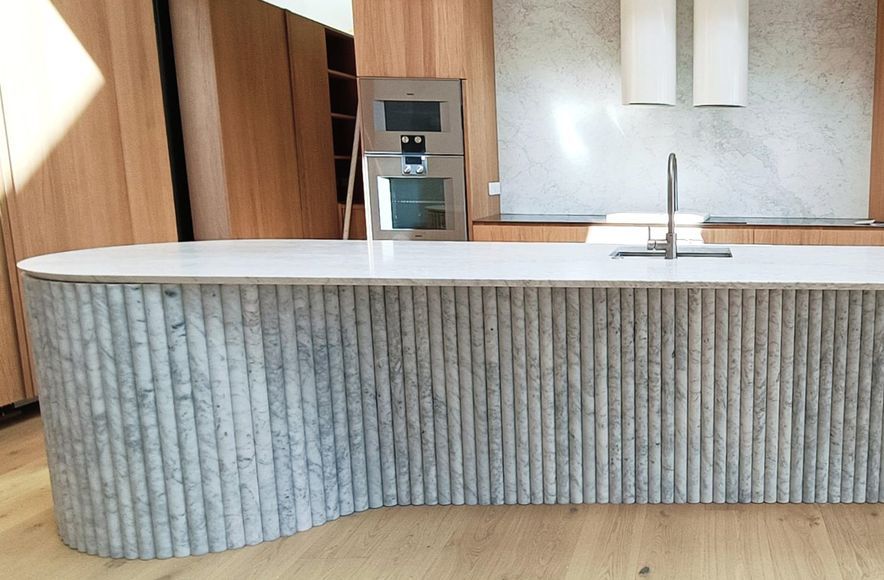 Damn Good Tiling - kitchen island flute marble tile