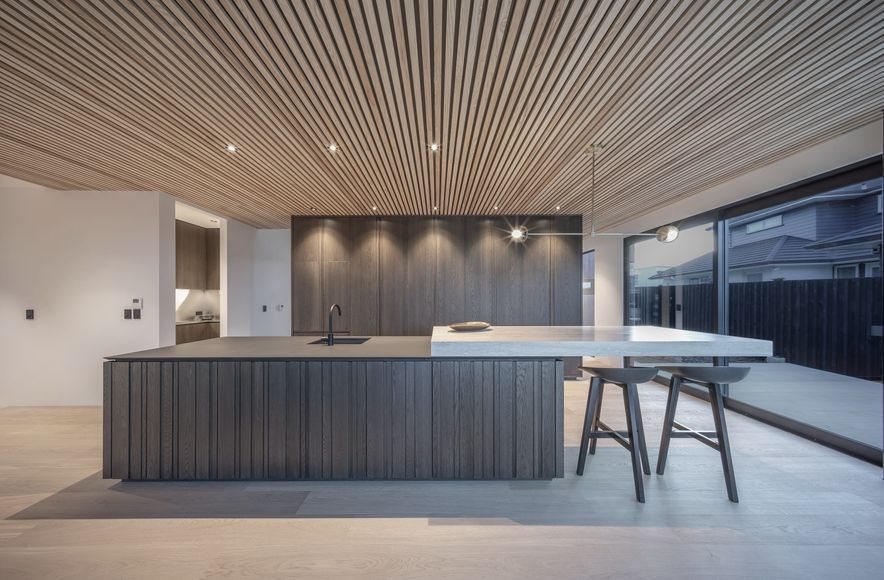 Dramatic kitchen with handleless design in a rural setting
