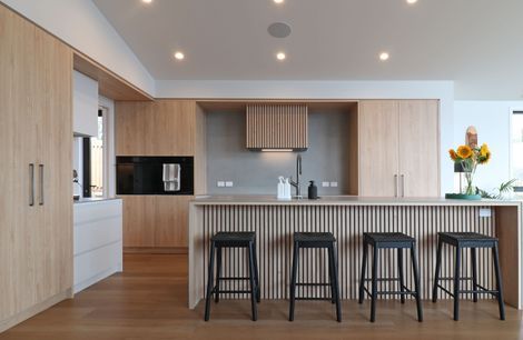 Elevated Elegance: A Family Kitchen Framing Harbour Views