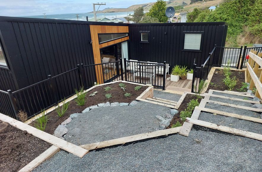 Maximising space and views on small, steep seaside section